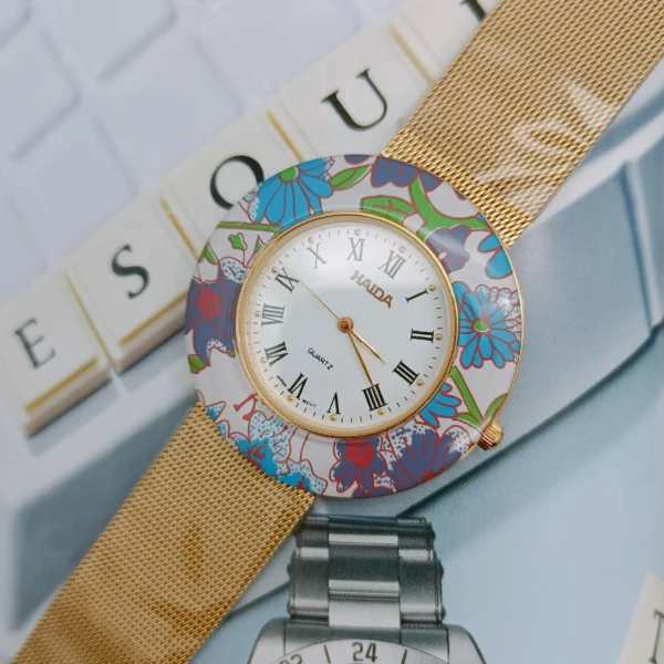 1997s Vintage Gold Women’s Round Watch – Colorful floral bezel detail