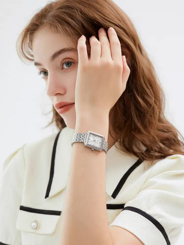 Stylish woman wearing a vintage silver wristwatch – WatchTrio collection