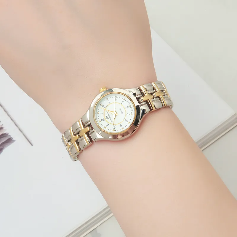 Elegant ladies' gold two-tone quartz watch with a white, crystal-set dial, offering a premium vintage look.