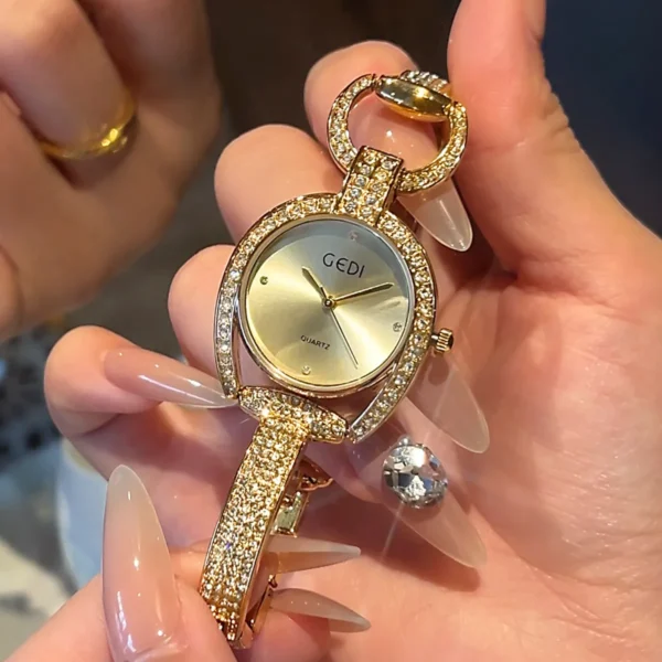 Gold vintage ladies watch with diamond bracelet close-up – Luxury women's quartz watch