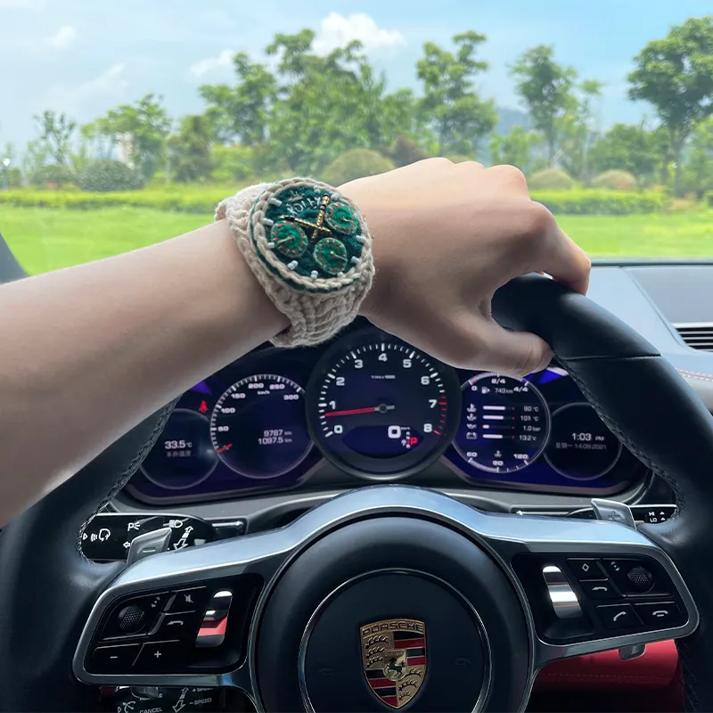 Handmade knitted yarn watch shown inside car