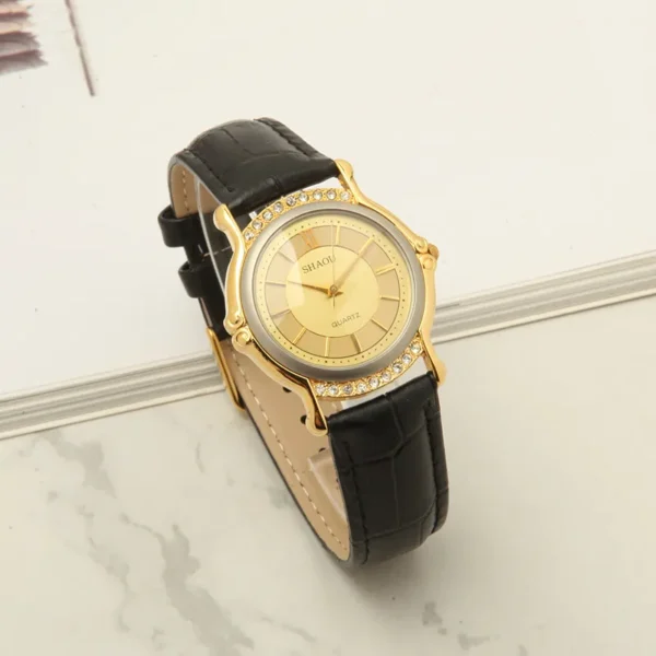 Vintage 1999 women’s leather quartz watch with gold case and black strap – front view