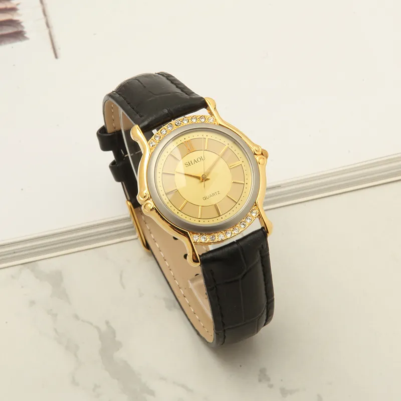 Vintage 1999 women’s leather quartz watch with gold case and black strap – front view