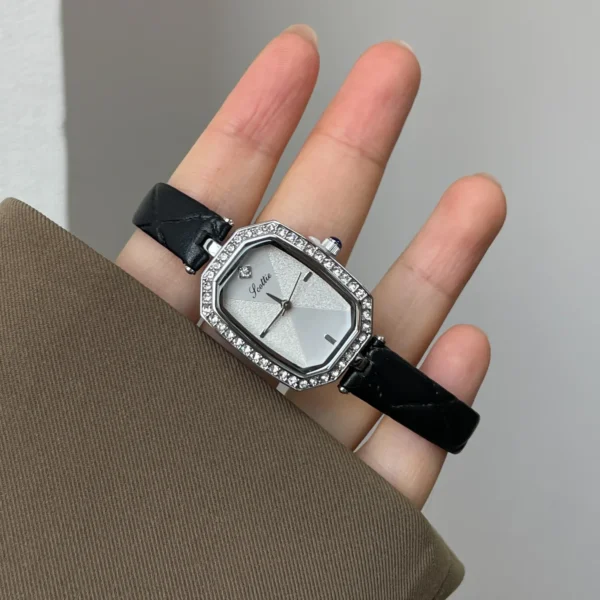 Silver octagon women’s watch with crystal bezel and black leather strap