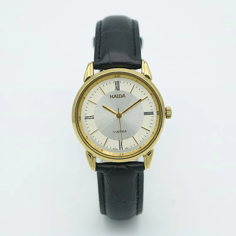 Vintage 1960s men’s leather watch with black strap and gold case – mechanical movement