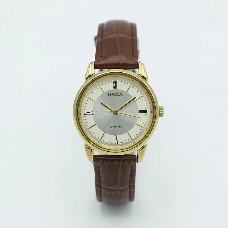 Classic 1960s men’s mechanical leather watch with brown strap and gold case