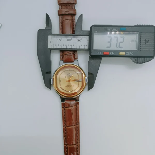 Vintage 1980s men’s leather watch with gold dial and brown strap – WatchTrio