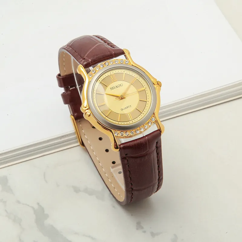 Vintage 1999 women’s quartz watch with gold case and brown strap – front view