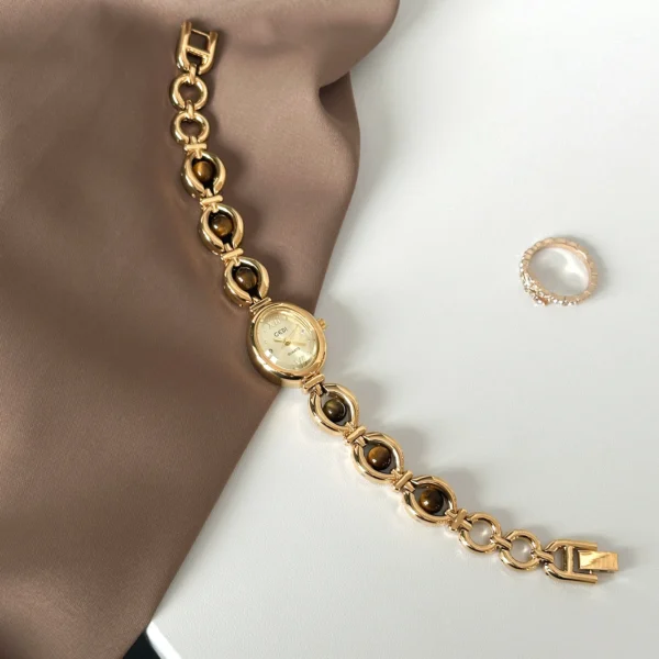 Vintage Gold Women’s Bracelet Watch with black gemstone accents – WatchTrio