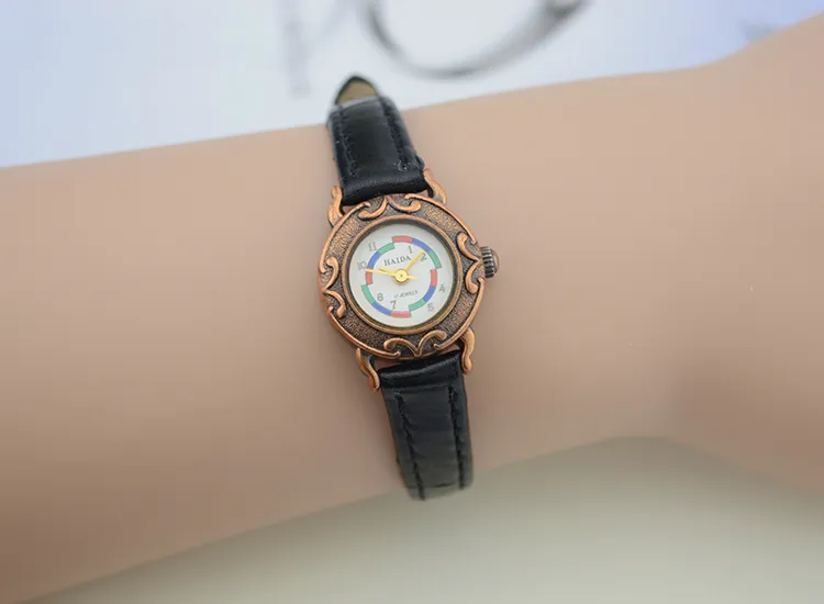 Vintage women’s black leather watch with brown case and letter dial – WatchTrio