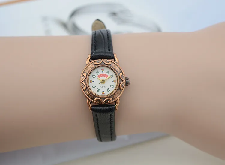 Vintage women’s black leather strap watch with brown case, alphabet colorful dial