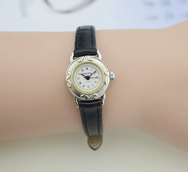 Vintage women’s black leather watch with silver case and Roman numeral dial – WatchTrio