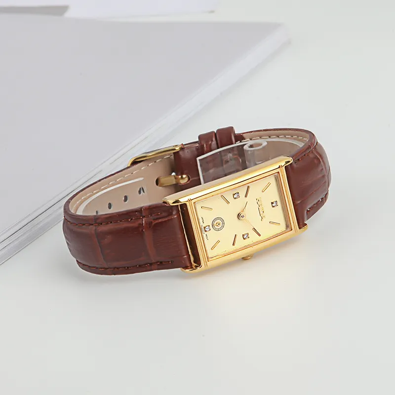Display of vintage women’s leather watch with rectangular gold dial – WatchTrio