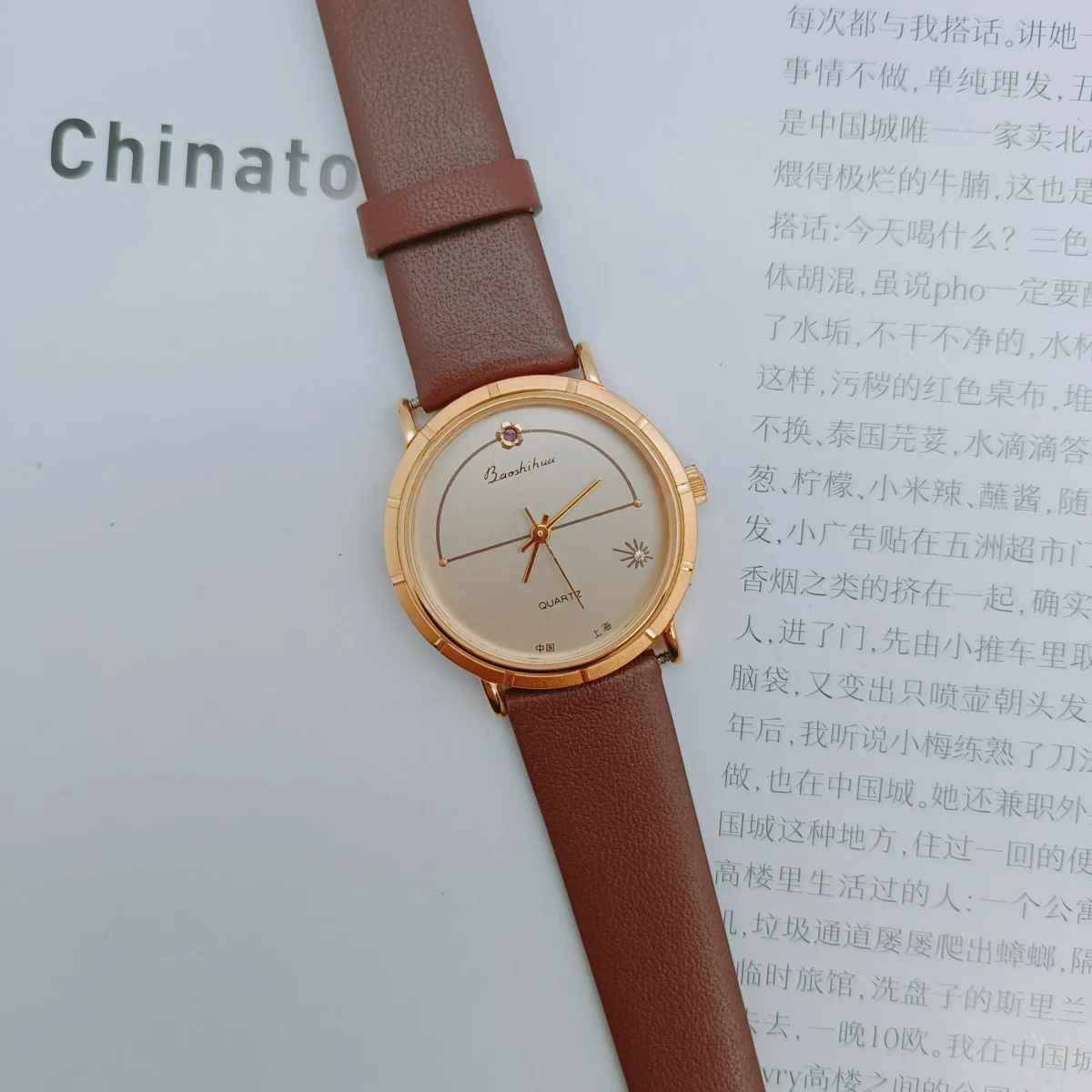 Vintage women’s brown leather watch with gold round case – flatlay display | WatchTrio