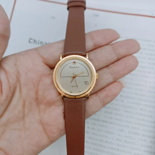 Vintage round gold bezel women’s watch with brown leather strap – WatchTrio