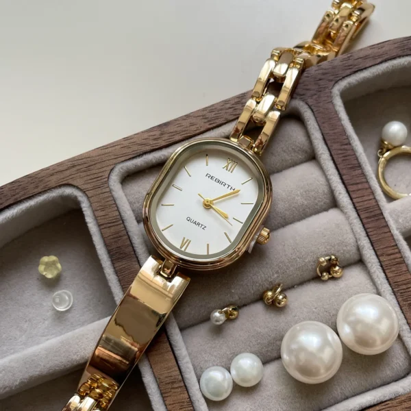 Close-up of vintage gold barrel women’s watch – classic dial and polished case