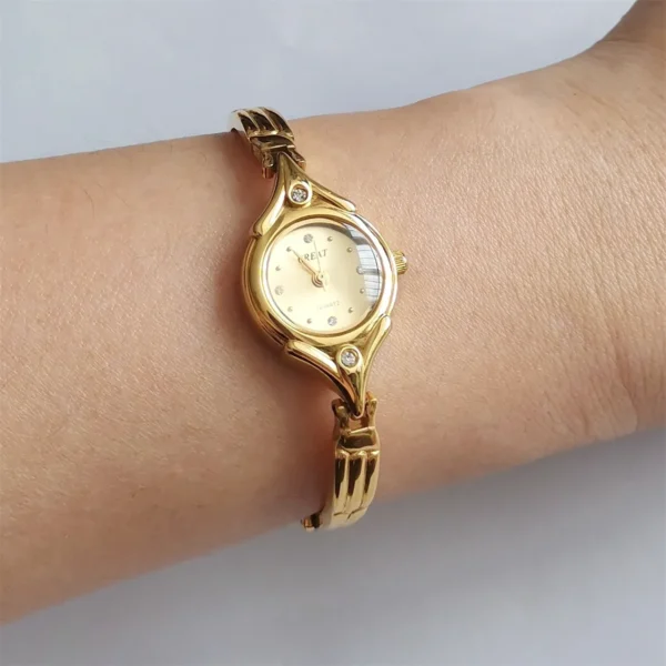 Gold vintage bracelet women’s watch on wrist