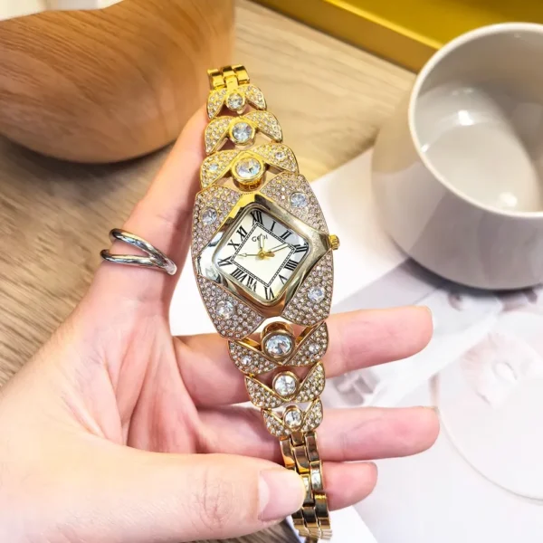 Vintage gold women’s diamond watch with hollow bracelet and mother-of-pearl dial – WatchTrio