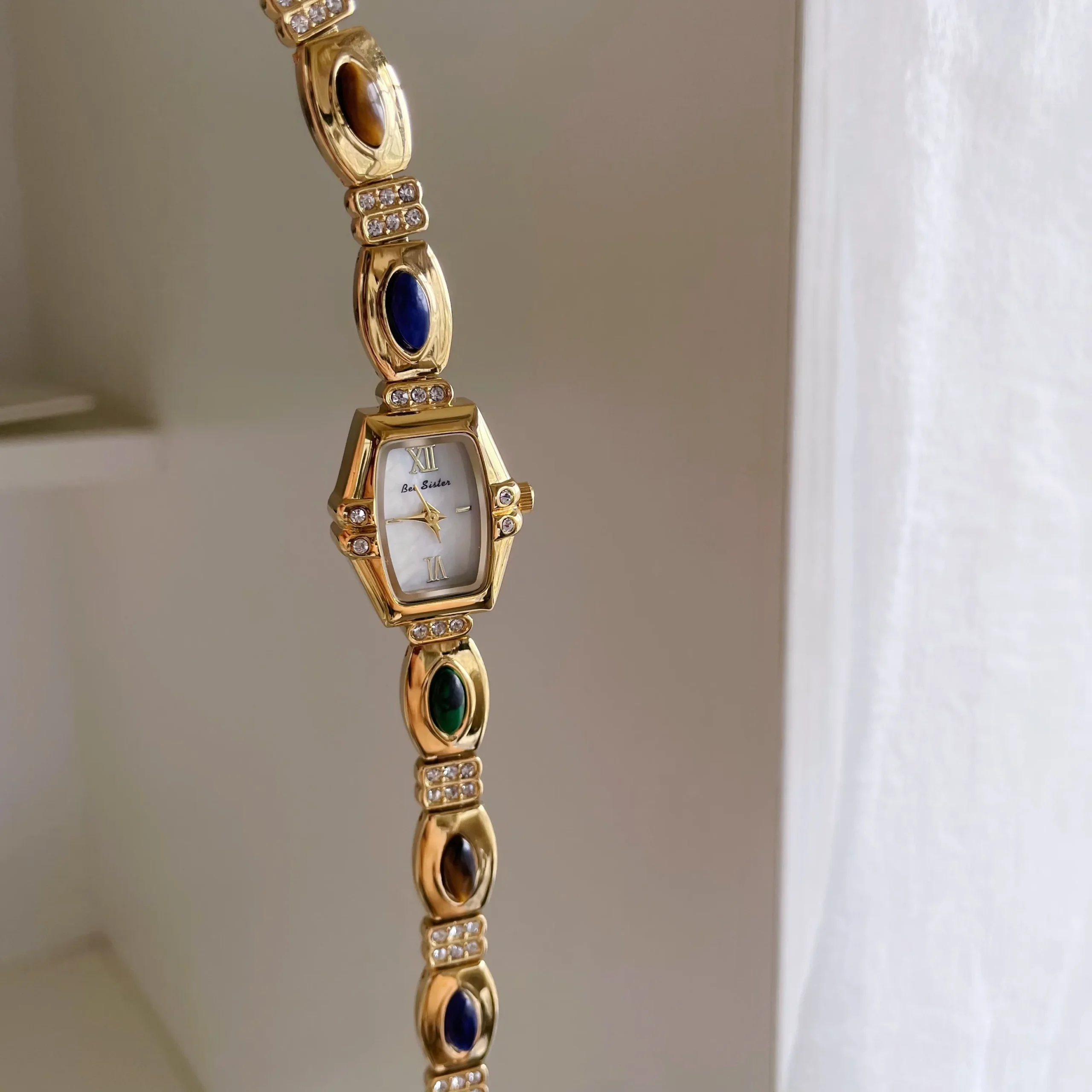 Retro gold bracelet watch for women with colorful gemstone strap and barrel dial – WatchTrio