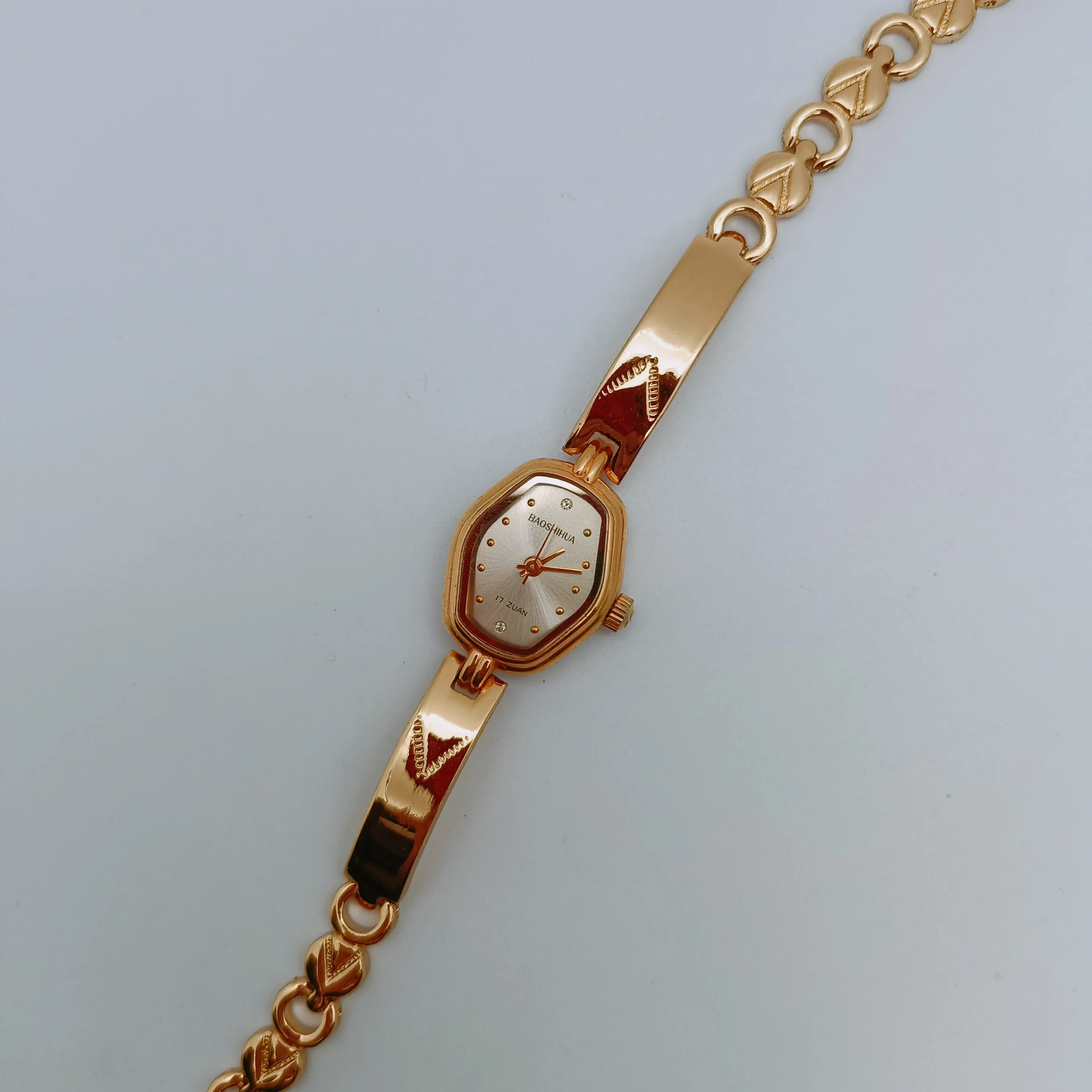Vintage gold women’s mechanical bracelet watch laid flat