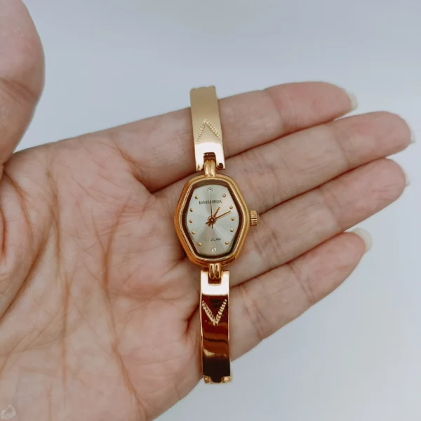 Vintage gold women’s mechanical watch with hexagonal dial front view