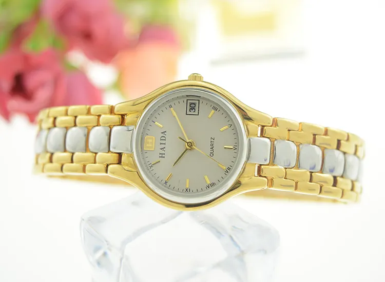 Vintage gold and silver ladies quartz watch with round dial and date – WatchTrio