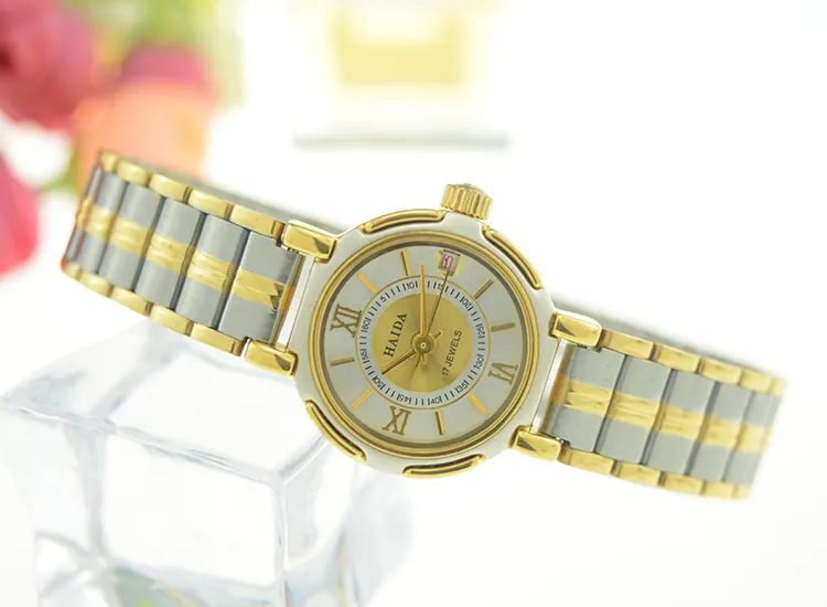 Close-up of vintage silver and gold women’s watch with hand-wound movement and 30m water resistance – WatchTrio