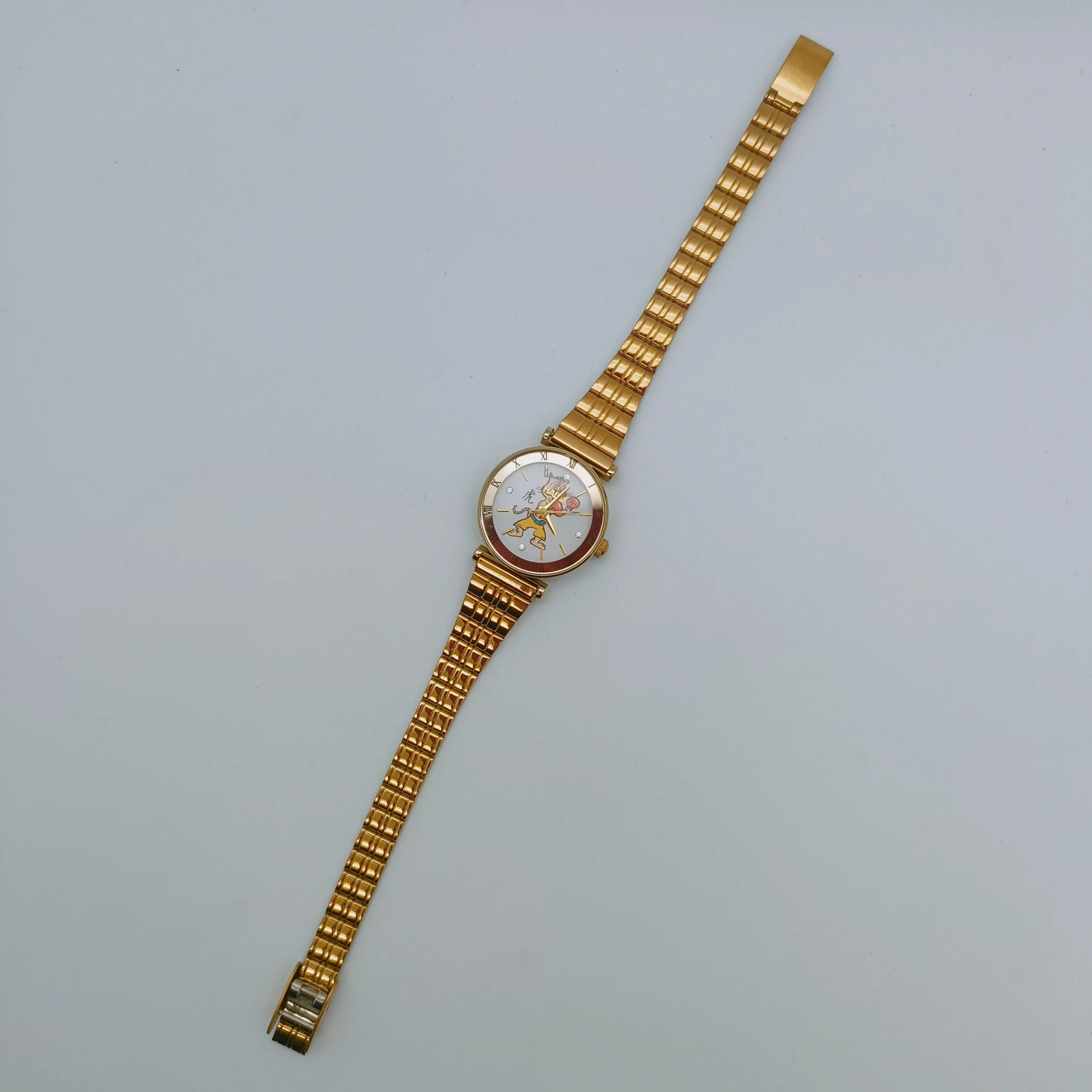 Full view of vintage gold women’s watch with tiger motif dial and metal strap – WatchTrio