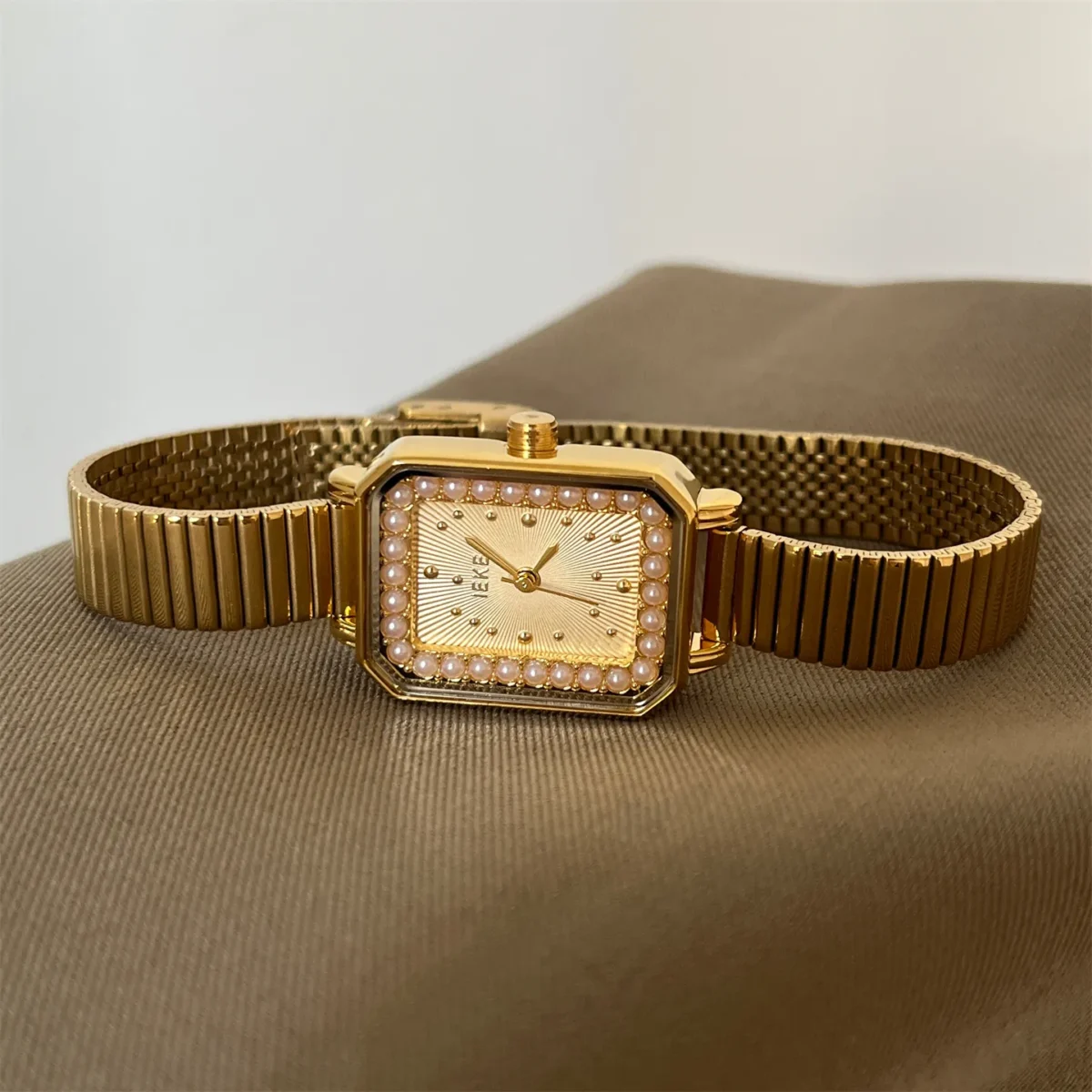 Vintage gold watch for women with pearl square dial and gold-tone strap