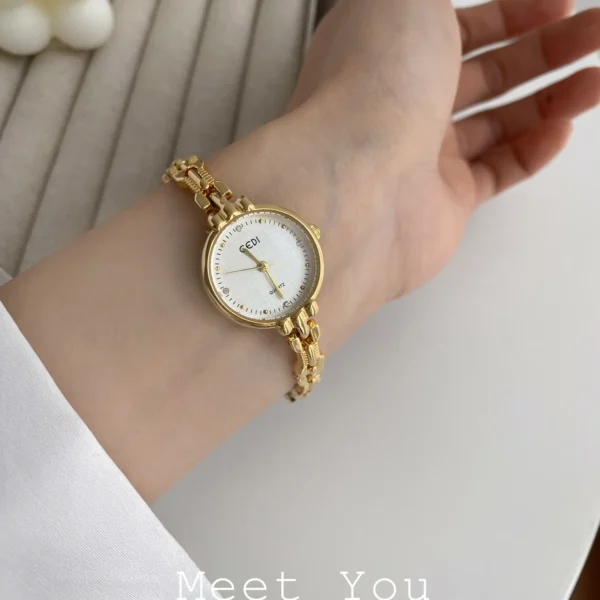 Close-up of gold women’s watch with mineral glass – WatchTrio
