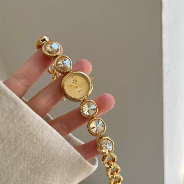 Vintage gold women’s watch with large crystal bracelet and gold dial – WatchTrio