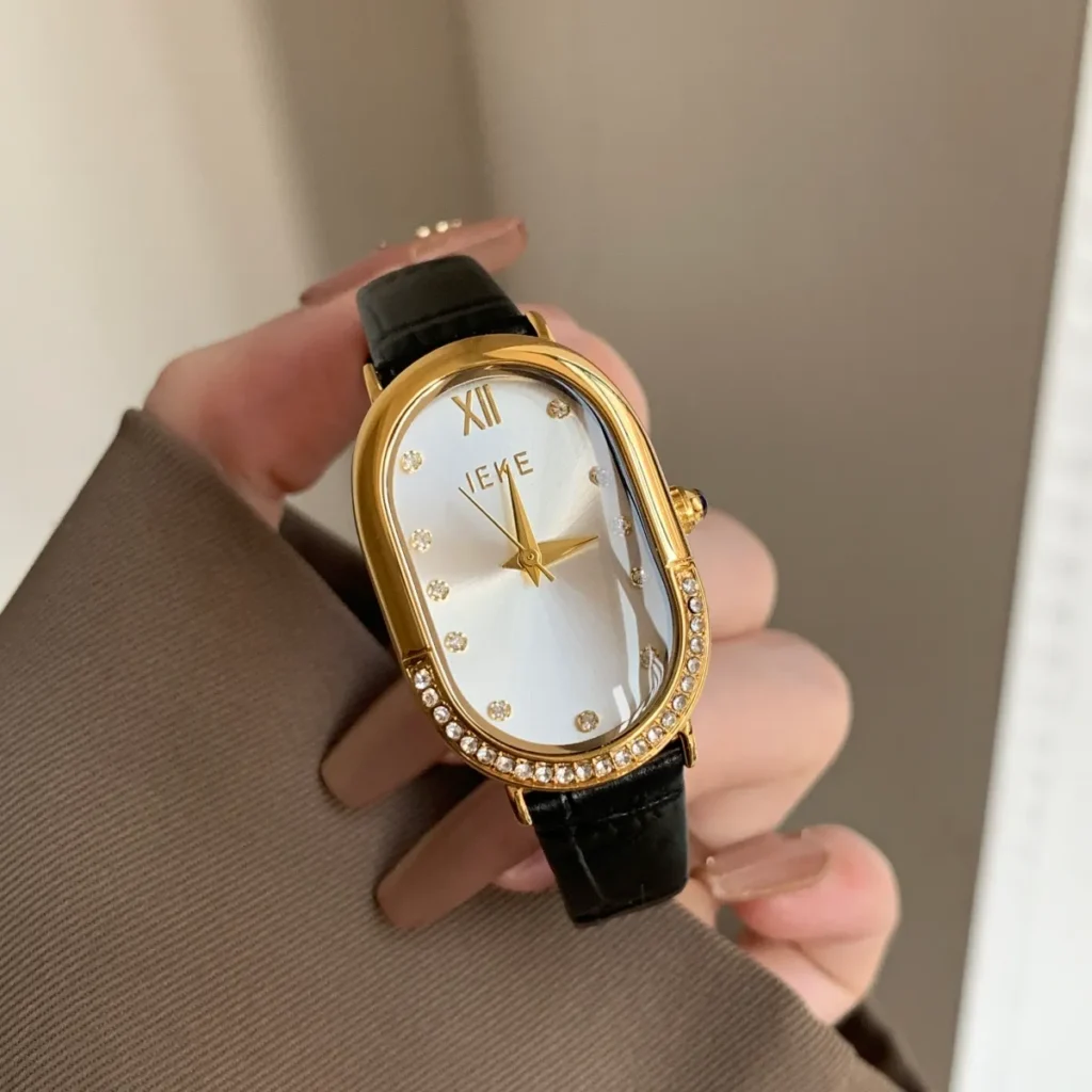 Vintage leather oval gold women’s watch with black strap – WatchTrio