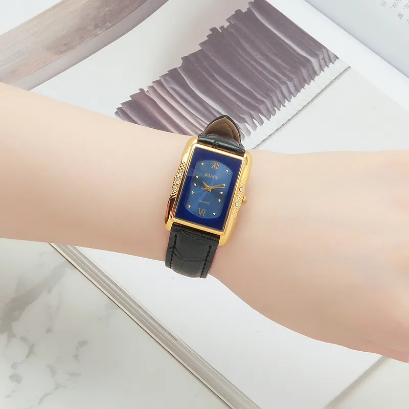 Vintage rectangular women’s watch with black leather strap and blue dial