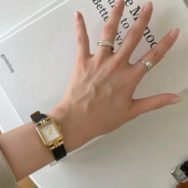 Vintage leather watch for women with black strap and gold case