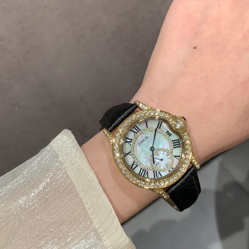 Vintage women’s leather watch with black strap and pearl dial – WatchTrio