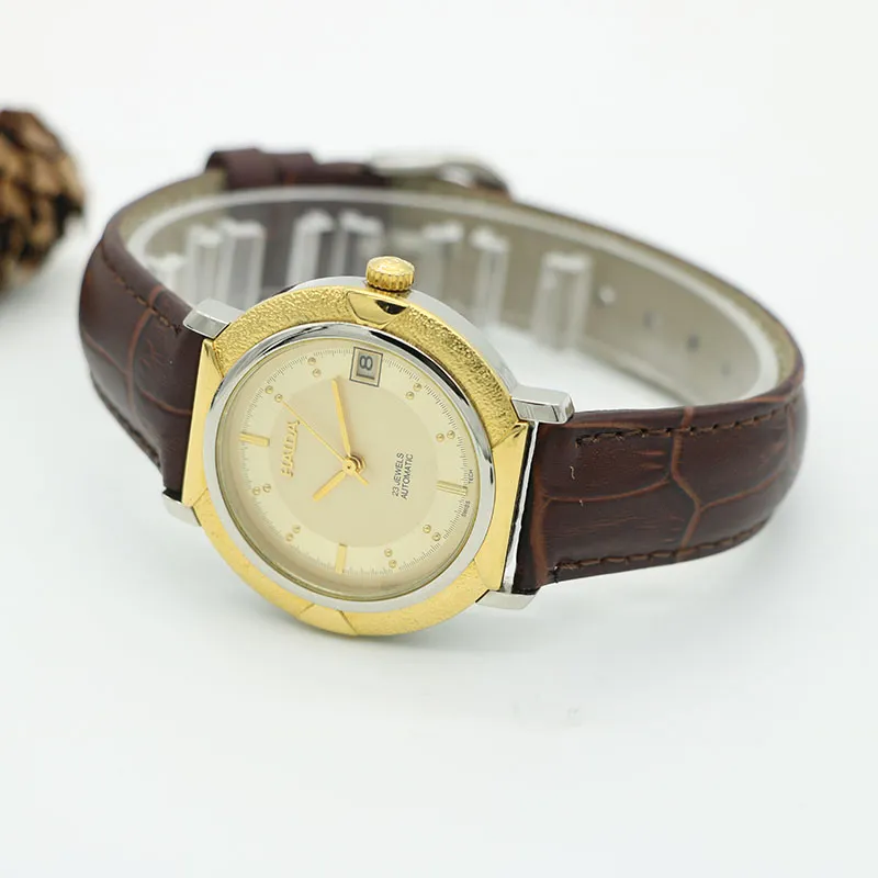 Vintage men’s leather watch with gold dial and automatic movement