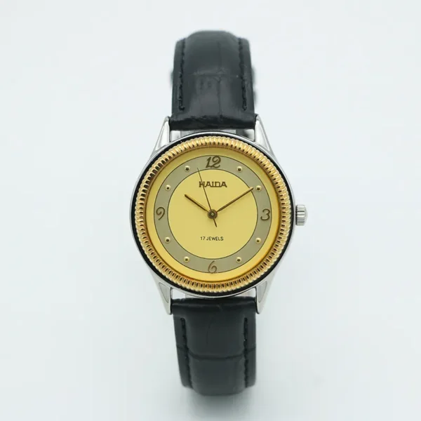 Vintage men’s leather watch with gold case and champagne dial, mechanical design
