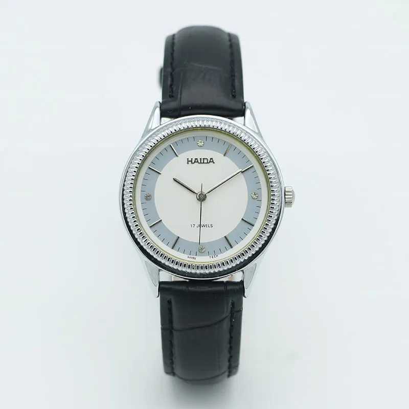 Vintage men’s leather watch with silver case and blue markers, mechanical