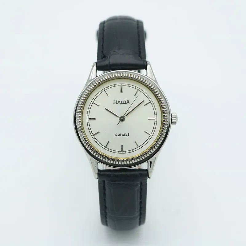 Vintage men’s leather watch with silver case and white dial, mechanical movement