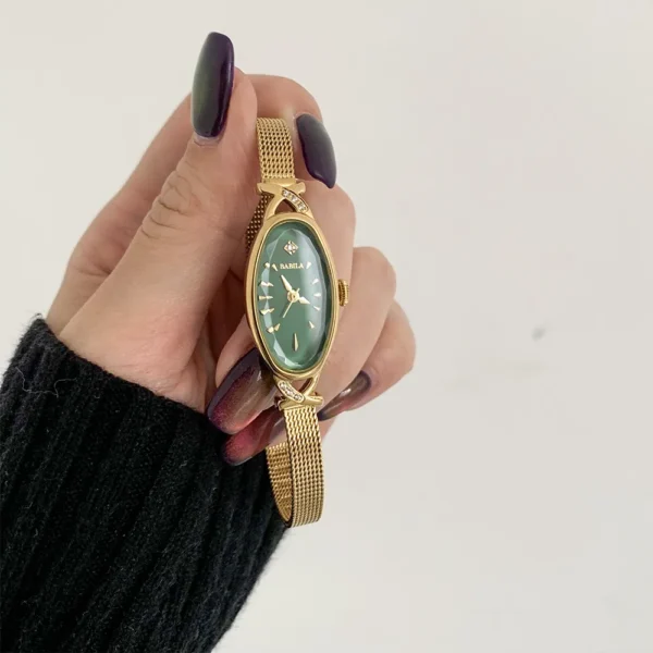 Vintage oval gold women’s watch with green dial and mesh bracelet
