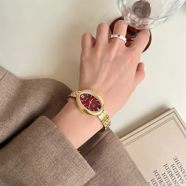 Vintage oval women’s watch with red dial and gold-tone bracelet – WatchTrio