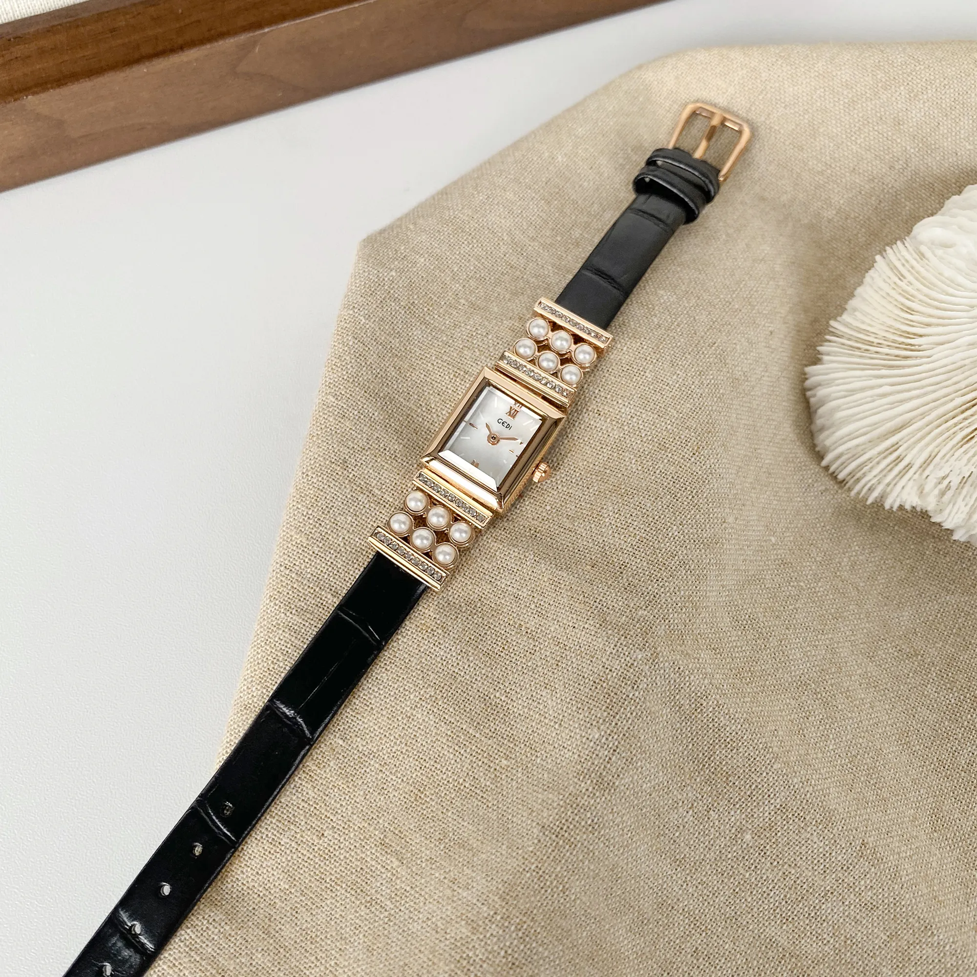 Vintage black leather women’s watch with gold pearl bezel – WatchTrio