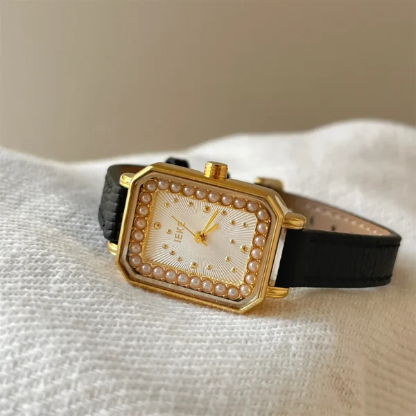 Retro square ladies watch in gold with pearl accents and black leather band