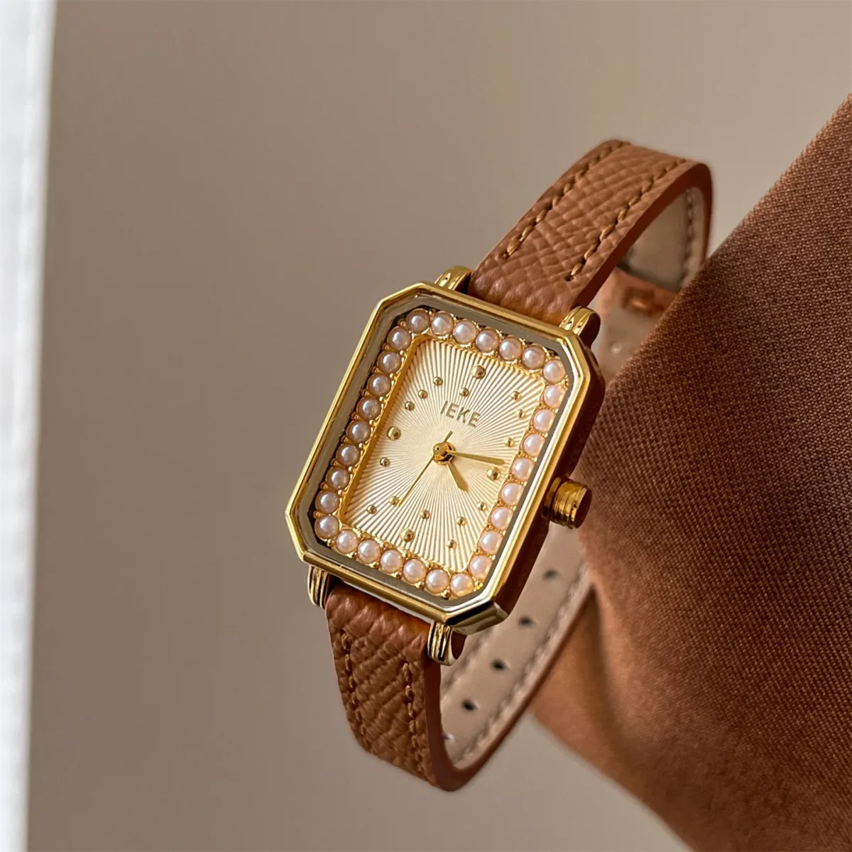 Vintage womens square watch with pearl bezel and brown leather strap