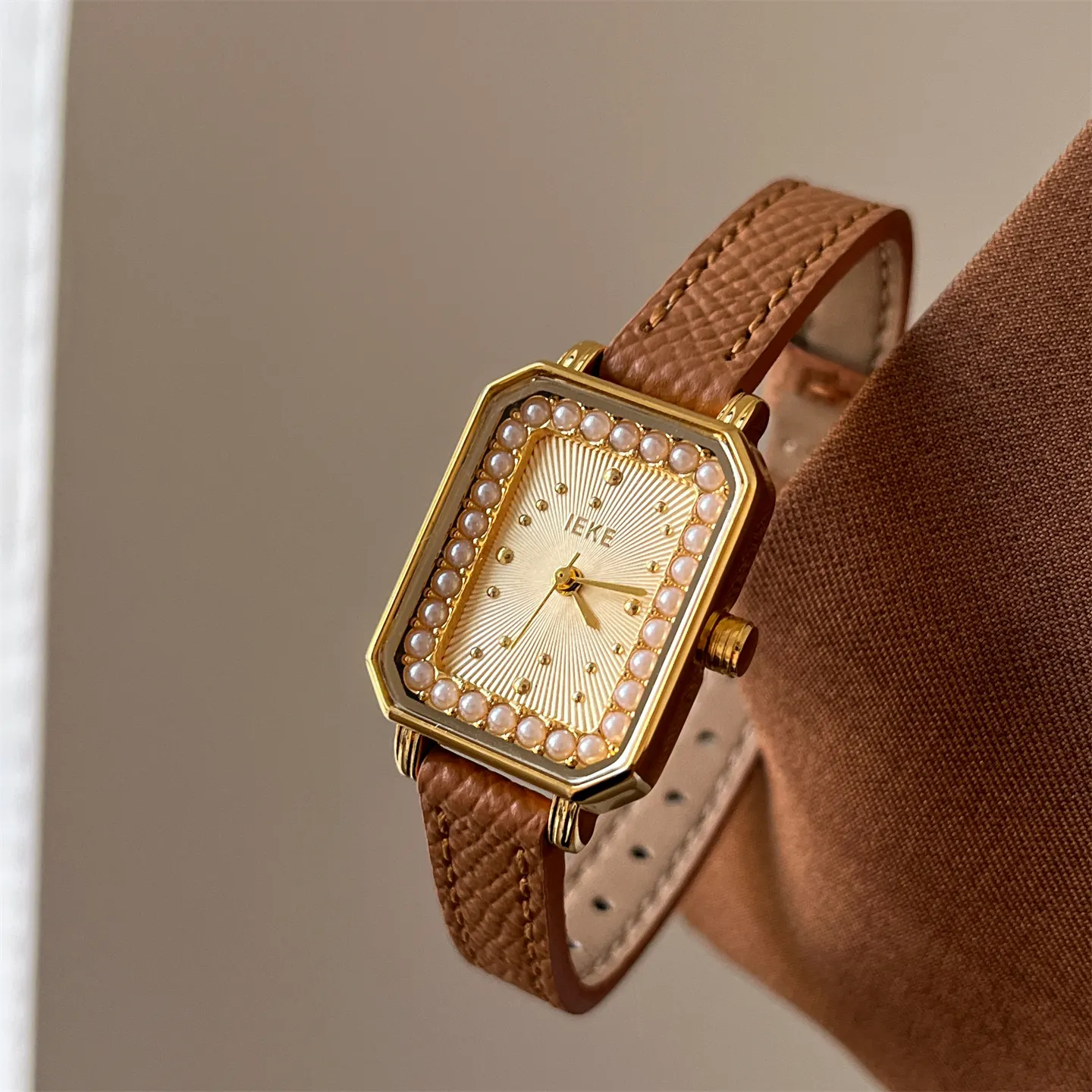 Vintage womens square watch with pearl bezel and brown leather strap