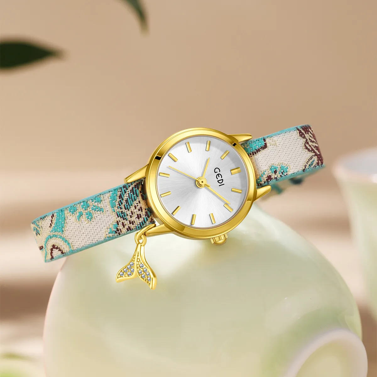 Vintage porcelain women’s watch with gold case and mermaid pendant