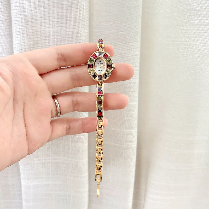 Hand-held view of Vintage Rainbow Gemstone Gold Women’s Bracelet Watch – 25mm oval dial – WatchTrio