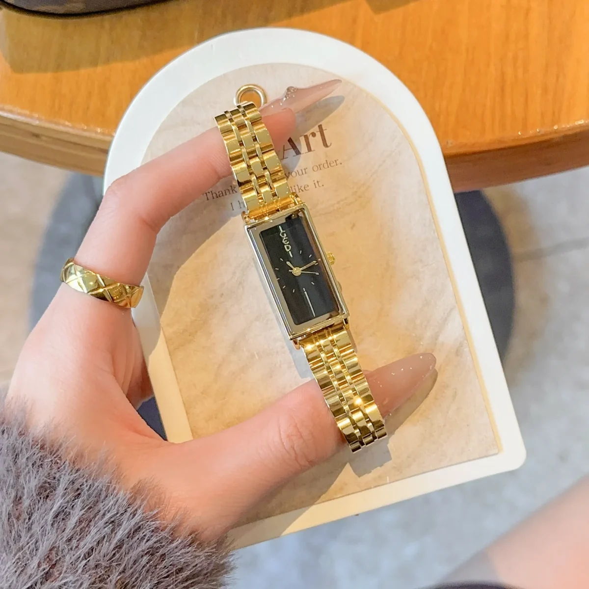 Vintage rectangle women’s gold watch with black dial – WatchTrio
