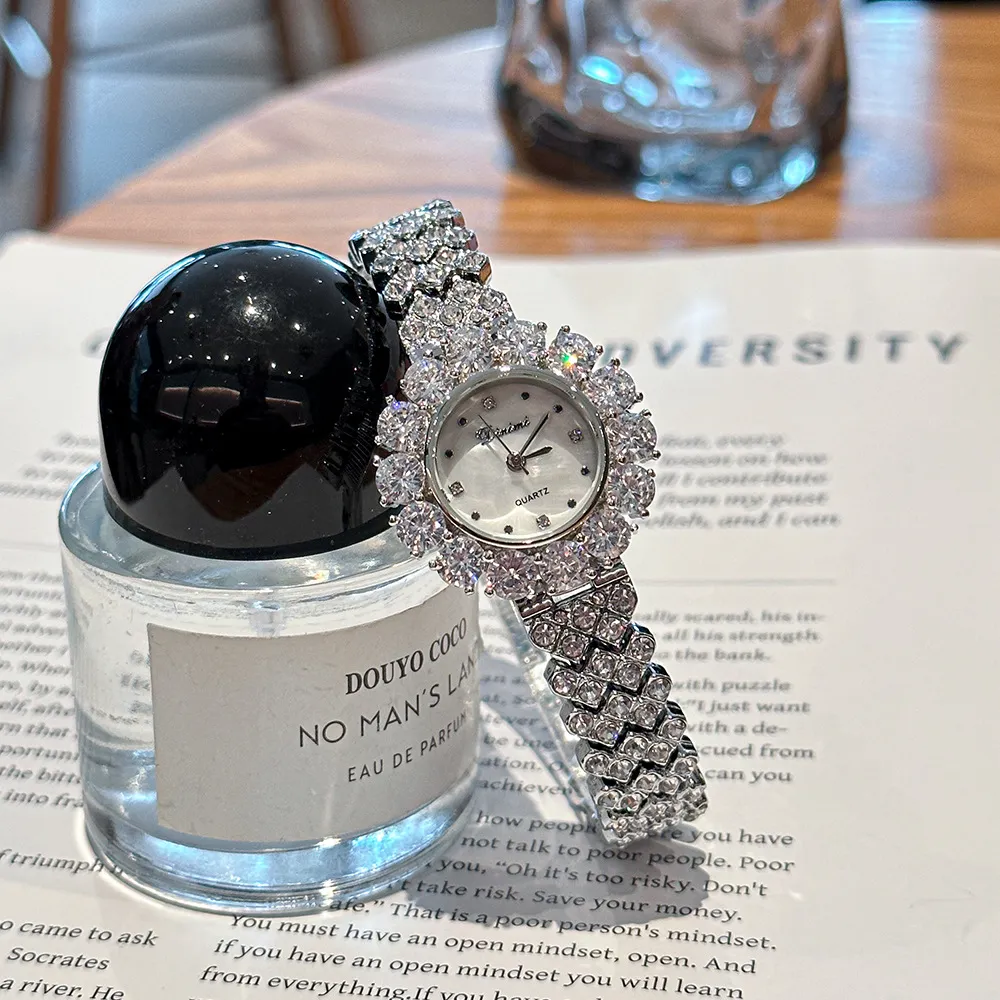 Vintage silver diamond women’s watch with crystal bezel on display – WatchTrio