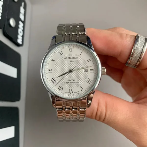 vintage silver mens watch with roman numeral dial and steel band